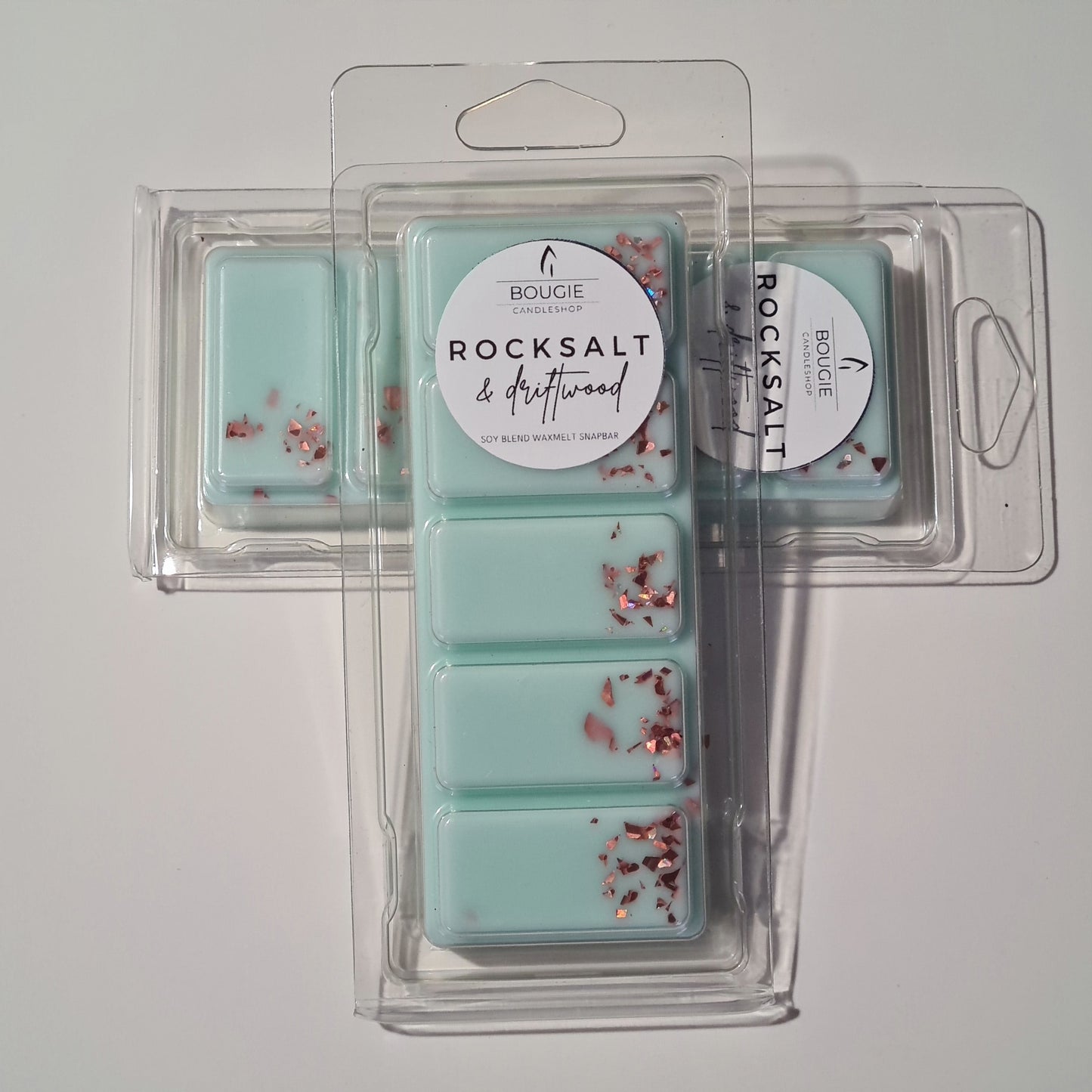 Waxmelt snapbar met de geur rocksalt & driftwood. Waxmelts bar in een blauw/groene kleur met koperkleurige glitters.