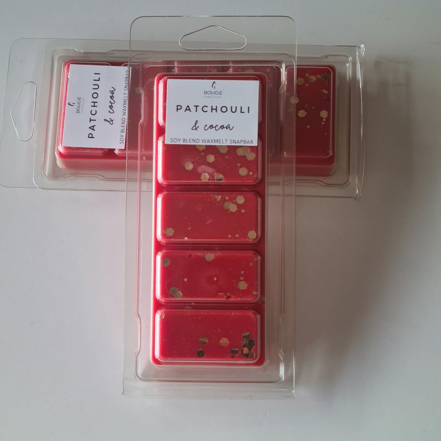 Waxmelt snapbar patchouli & cocoa, rood van kleur met gouden glitters, waxmelts.
