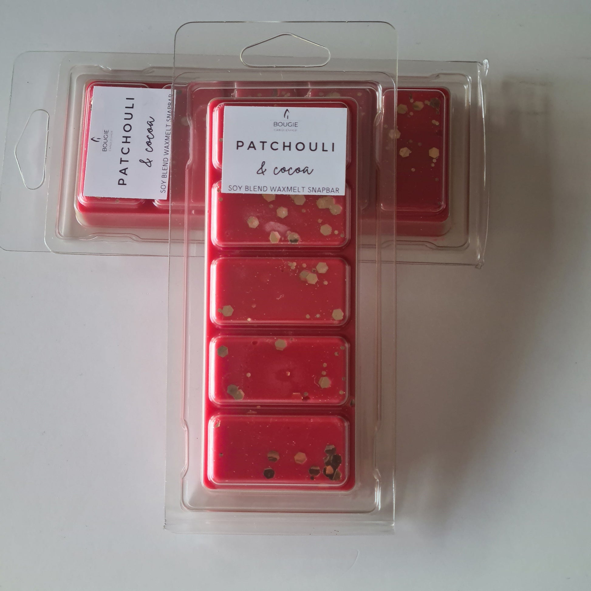 Waxmelt snapbar patchouli & cocoa, rood van kleur met gouden glitters, waxmelts.